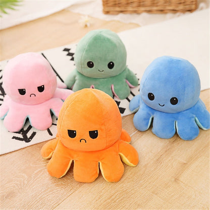Reversible octopus plush toy showing happy and sad faces